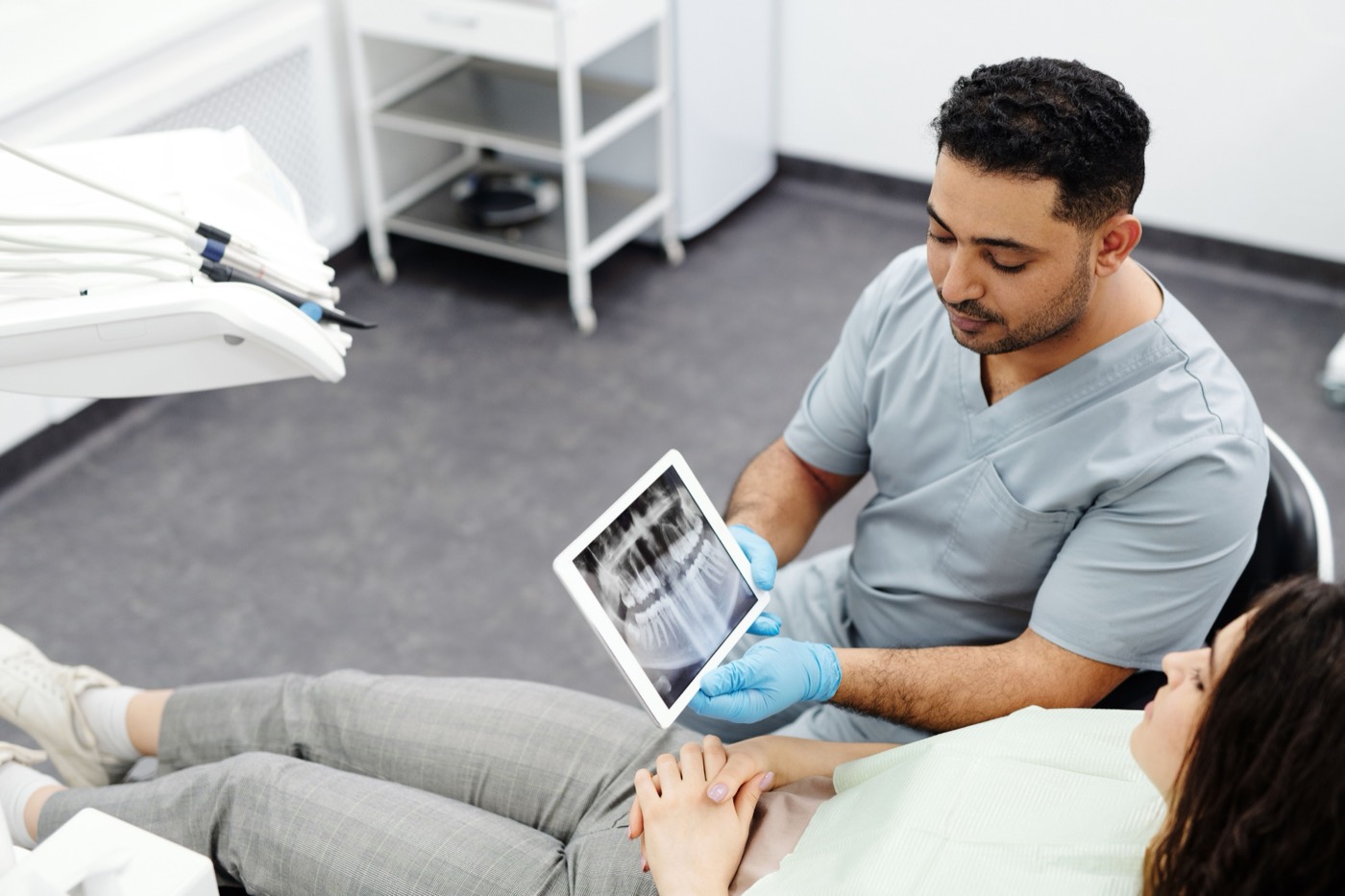 Care32 dentist reviewing a dental X-ray with a patient in Kukatpally